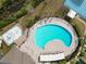 Aerial view of community pool with surrounding lounge chairs at 18398 Aylesbury Ln, Land O Lakes, FL 34638