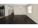 Bright dining room features hardwood floors and a chandelier at 18398 Aylesbury Ln, Land O Lakes, FL 34638