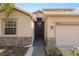 House exterior with walkway and two-car garage at 18398 Aylesbury Ln, Land O Lakes, FL 34638