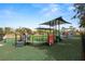 Playground with train-themed equipment and shaded areas at 18398 Aylesbury Ln, Land O Lakes, FL 34638