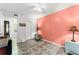 Bedroom with tiled floors and coral colored walls at 1950 58Th N Ave # 9, St Petersburg, FL 33714