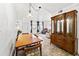 Dining room with wood table and hutch, adjacent to living room at 1950 58Th N Ave # 9, St Petersburg, FL 33714