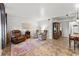 Living room with tiled floors, armchairs, and a view into the dining area at 1950 58Th N Ave # 9, St Petersburg, FL 33714