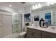 Modern bathroom with double vanity and walk-in shower at 2093 Hallier Cv, Wesley Chapel, FL 33543