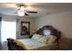 Comfortable bedroom with a large bed, fan, and ample natural light at 2098 Zellwood Ter, North Port, FL 34286