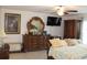 Spacious main bedroom featuring a ceiling fan and comfortable bedding at 2098 Zellwood Ter, North Port, FL 34286