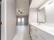 Bathroom showing modern sink and vanity, and view of the bedroom with natural lighting at 2372 Hanover Dr, Dunedin, FL 34698