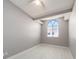 Bedroom with a vaulted ceiling and arched window at 2372 Hanover Dr, Dunedin, FL 34698