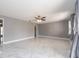 Expansive bedroom showcasing marble floors, ceiling fan, and a walk-in closet at 2372 Hanover Dr, Dunedin, FL 34698