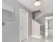 Entryway with marble floors, white doors, and stairs to upper floor at 2372 Hanover Dr, Dunedin, FL 34698