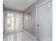 Bright entryway with marble floors, double doors, and white walls at 2372 Hanover Dr, Dunedin, FL 34698