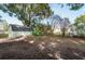 Large backyard with shed and mature trees at 27103 Wakefield Dr, Brooksville, FL 34602