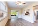 Casual dining area with kitchen pass-through and view of the screened porch at 27103 Wakefield Dr, Brooksville, FL 34602