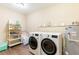 Laundry room with washer, dryer, and shelving for storage at 27103 Wakefield Dr, Brooksville, FL 34602