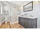 Elegant bathroom with a frameless shower and double vanity at 2751 2Nd S Ave, St Petersburg, FL 33712