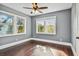 Well-lit bedroom featuring hardwood floors and multiple windows at 2751 2Nd S Ave, St Petersburg, FL 33712