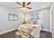 Bright bedroom with a queen bed, ample natural light, and ceiling fan at 2751 2Nd S Ave, St Petersburg, FL 33712