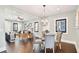 Dining area with glass-top table and modern chandelier at 2751 2Nd S Ave, St Petersburg, FL 33712