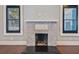 Whitewashed brick fireplace with dark hearth at 2751 2Nd S Ave, St Petersburg, FL 33712