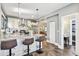 Kitchen island with seating and view into living and dining areas at 2751 2Nd S Ave, St Petersburg, FL 33712