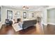 Living room with a fireplace, dark brown sofa, and wooden floors at 2751 2Nd S Ave, St Petersburg, FL 33712