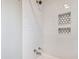 Clean shower with subway tile and hexagon niche at 2751 2Nd S Ave, St Petersburg, FL 33712