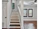 Staircase with dark wood steps and white risers at 2751 2Nd S Ave, St Petersburg, FL 33712