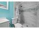 Clean bathroom with a shower/tub combo and teal walls at 2809 49Th N St, St Petersburg, FL 33710