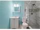 Clean bathroom with white vanity, toilet, and shower with marble tile at 2809 49Th N St, St Petersburg, FL 33710