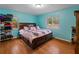 Spacious bedroom with king-size bed and wood flooring at 2809 49Th N St, St Petersburg, FL 33710