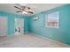 Bright bedroom with ceiling fan, tile floors, and access to a bathroom at 2809 49Th N St, St Petersburg, FL 33710