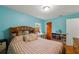 Bedroom with striped bedding, wood floors, and built-in shelving at 2809 49Th N St, St Petersburg, FL 33710