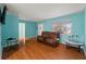 Living room with brown recliner and wood flooring at 2809 49Th N St, St Petersburg, FL 33710