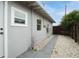 Sidewalk leading to the back of the house with gravel pathway at 2809 49Th N St, St Petersburg, FL 33710