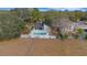 Aerial view of house with pool and fenced backyard at 2826 Kavalier Dr, Palm Harbor, FL 34684