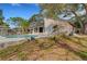 House and fenced-in pool area with mature trees at 2826 Kavalier Dr, Palm Harbor, FL 34684