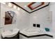 Bathroom with corner jacuzzi tub, dark vanity, and white tile at 2826 Kavalier Dr, Palm Harbor, FL 34684