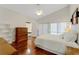 Spacious bedroom with hardwood floors, a king-size bed and built-in shelving at 2826 Kavalier Dr, Palm Harbor, FL 34684