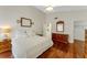 Main bedroom with hardwood floors and large walk-in closet at 2826 Kavalier Dr, Palm Harbor, FL 34684