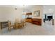 Dining room with glass table, chairs, and adjacent kitchen at 2826 Kavalier Dr, Palm Harbor, FL 34684