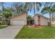 Attractive single-story house with a two-car garage and landscaped yard at 2826 Kavalier Dr, Palm Harbor, FL 34684