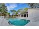 Relaxing rectangular pool with concrete decking at 2826 Kavalier Dr, Palm Harbor, FL 34684