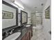 Bathroom with double vanity, bathtub, and shower at 305 Crayford Pl, Valrico, FL 33594