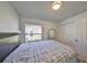 Bedroom with double bed, backyard view, and built-in closet at 305 Crayford Pl, Valrico, FL 33594