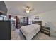 Spacious bedroom with double bed, dresser, and ceiling fan at 305 Crayford Pl, Valrico, FL 33594