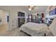 Bedroom with a double bed, dresser, and access to the bathroom at 305 Crayford Pl, Valrico, FL 33594