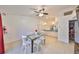 Bright dining room with glass table and seating for four at 305 Crayford Pl, Valrico, FL 33594