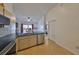 Kitchen with stainless steel appliances and tile flooring at 305 Crayford Pl, Valrico, FL 33594