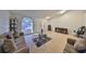 Living room with tile flooring and access to the front yard at 305 Crayford Pl, Valrico, FL 33594