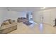 Living room with tile flooring and arched window at 305 Crayford Pl, Valrico, FL 33594